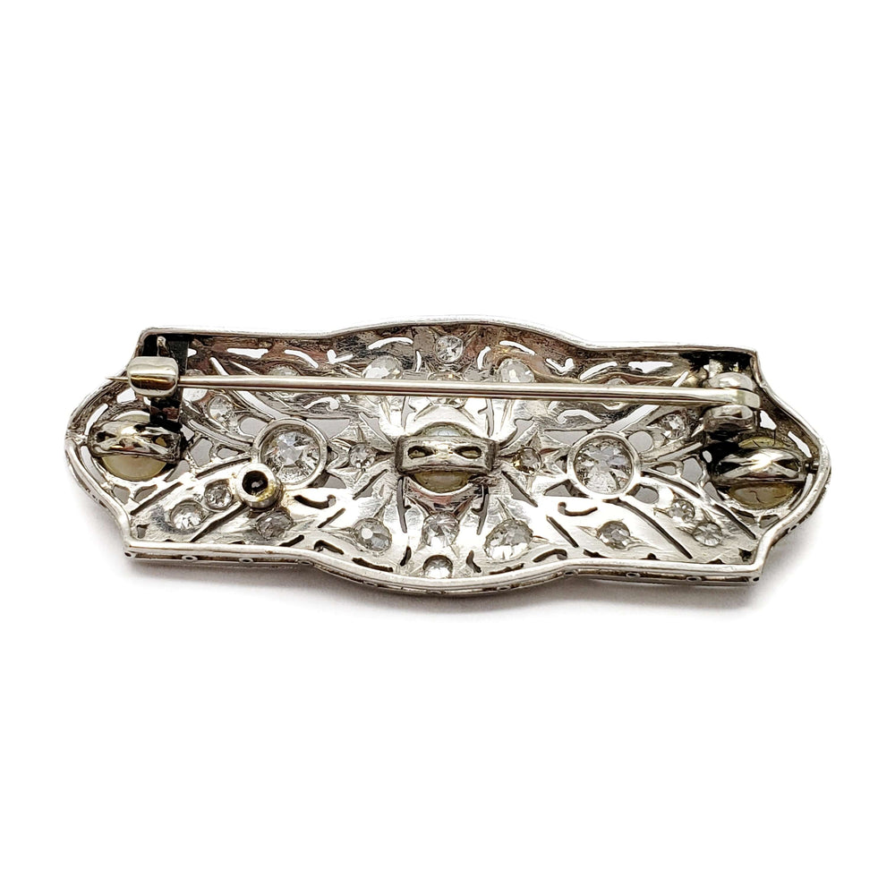 Back view of Edwardian platinum brooch with filigree work and pin clasp