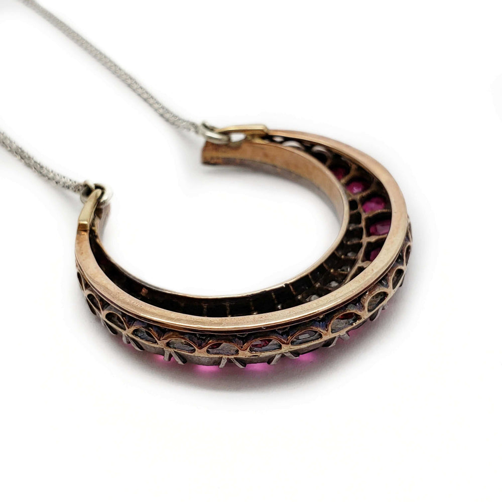 Reverse view of Victorian silver and rose gold crescent necklace with openwork gallery.