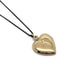 Back view of vintage 14kt yellow gold heart locket pendant on a black chain