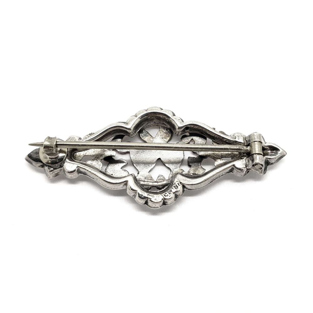 Back view of vintage silver and rose gold double heart pin showing pin clasp
