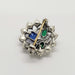 Back view of vintage sterling silver brooch showing pin and glass stone settings