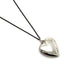 Back of vintage sterling silver heart locket showing 'STERLING' stamp