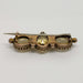 Back view of vintage yellow gold brooch with three faceted citrine stones