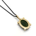 Back of 14kt yellow gold pendant showing oval jade setting and hallmark