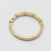 Back view of 14kt yellow gold wedding ring with leaf and diamond details