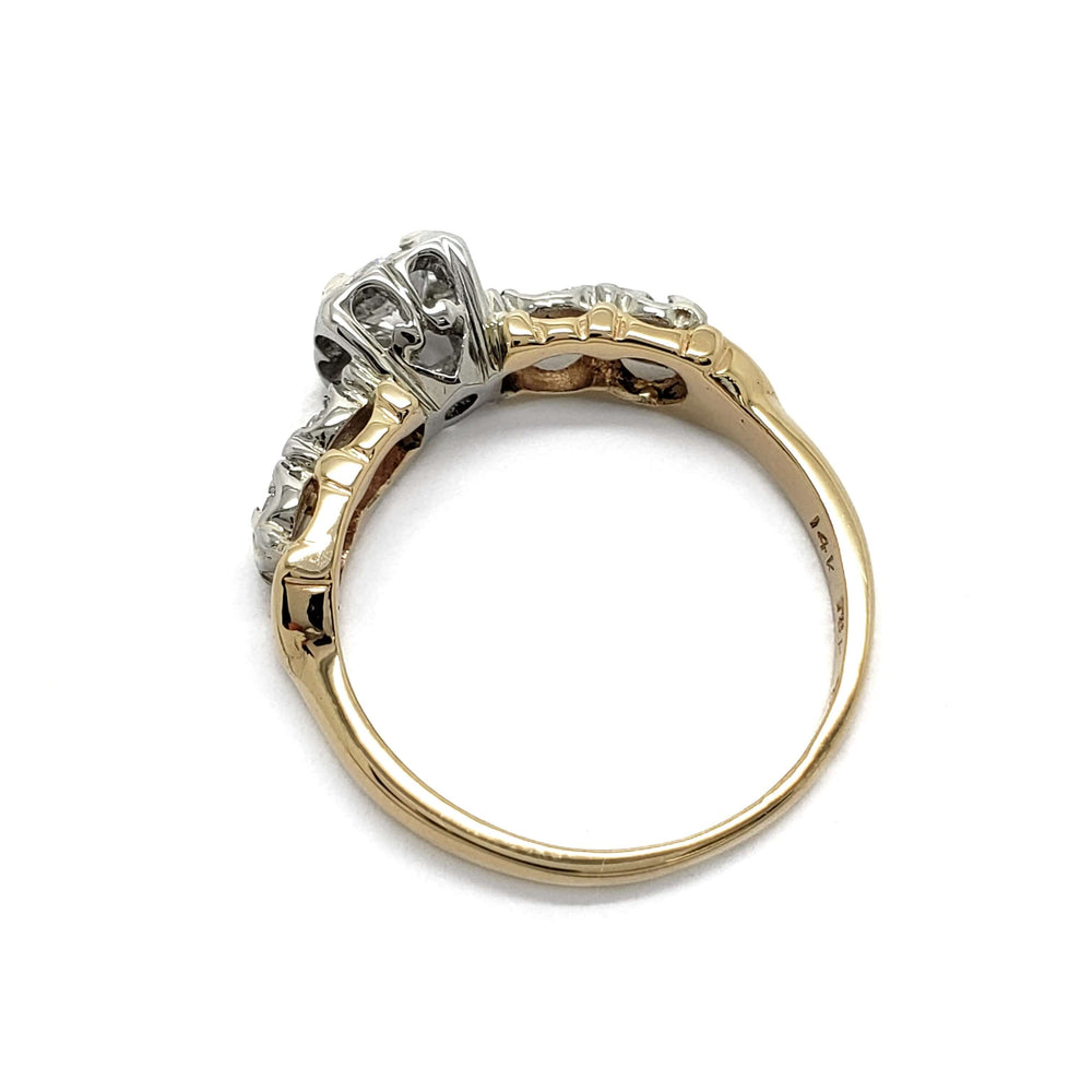 Back view of antique five stone diamond ring showing yellow gold band