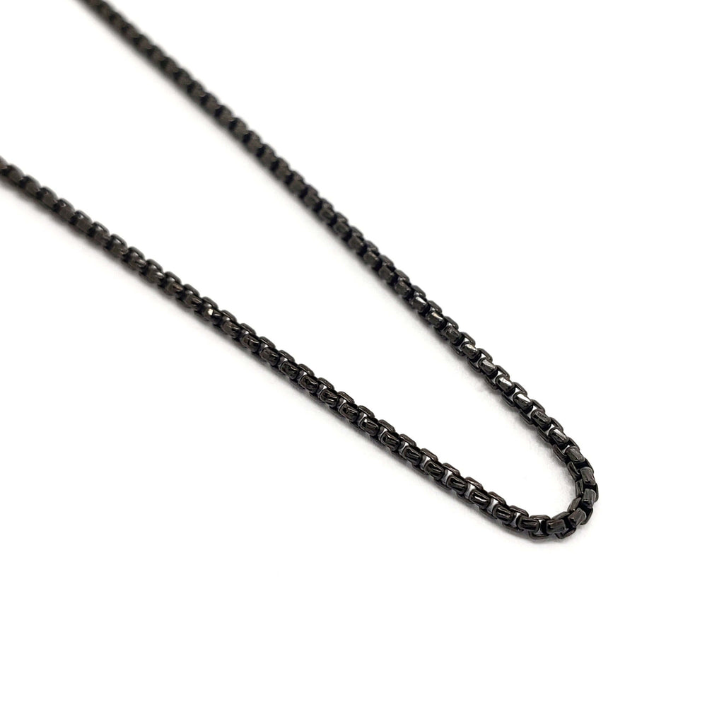 Close-up of blackened sterling silver box chain with oxidized finish