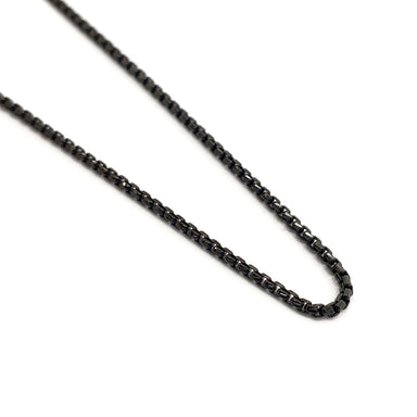 Close-up of blackened sterling silver box chain with oxidized finish