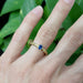 Blue sapphire and yellow gold wheat detail ring shown on hand