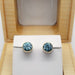 Blue zircon bezel earrings in 14kt yellow gold presented in an open cedar jewellery box