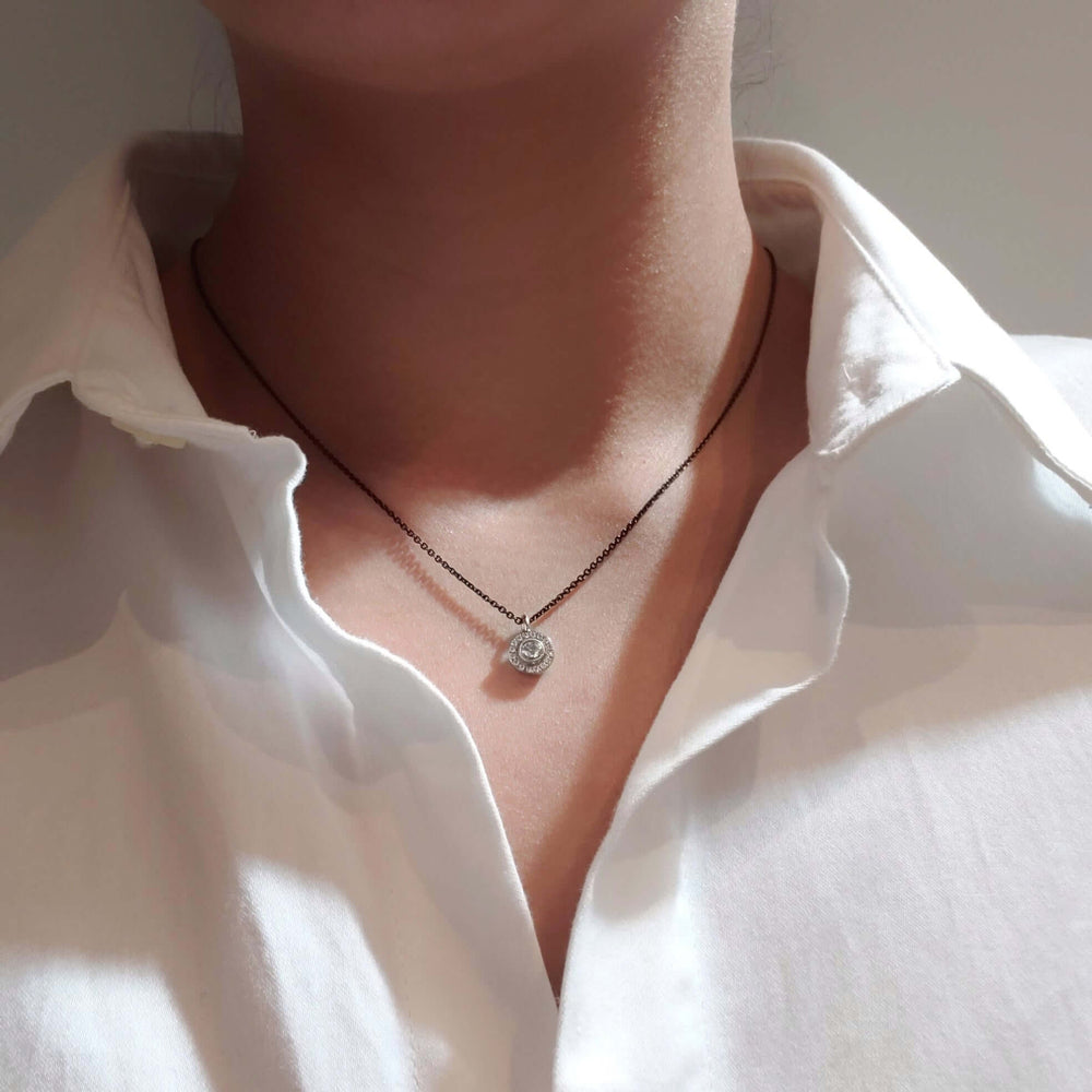 Canadian diamond halo pendant necklace in 14kt white gold shown on model