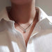 Canadian diamond halo pendant necklace in 14kt white gold shown on model