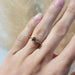 Champagne diamond and yellow gold engagement ring worn on hand