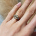 14kt yellow gold three-stone lab diamond ring worn on hand