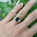 Charlotte Australian sapphire and lab diamond ring worn on a hand