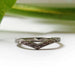 Chevron-shaped white gold wedding band with engraved wheat pattern and millgrain edge