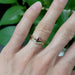 Chevron diamond band paired with a ruby ring on hand