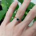 Chevron diamond wedding ring paired with engraved rose gold and blue sapphire ring
