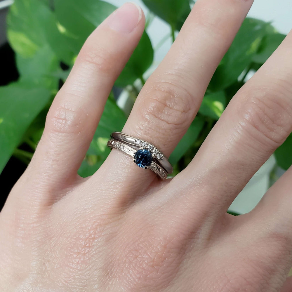 Chevron diamond wedding ring paired with engraved sapphire engagement ring