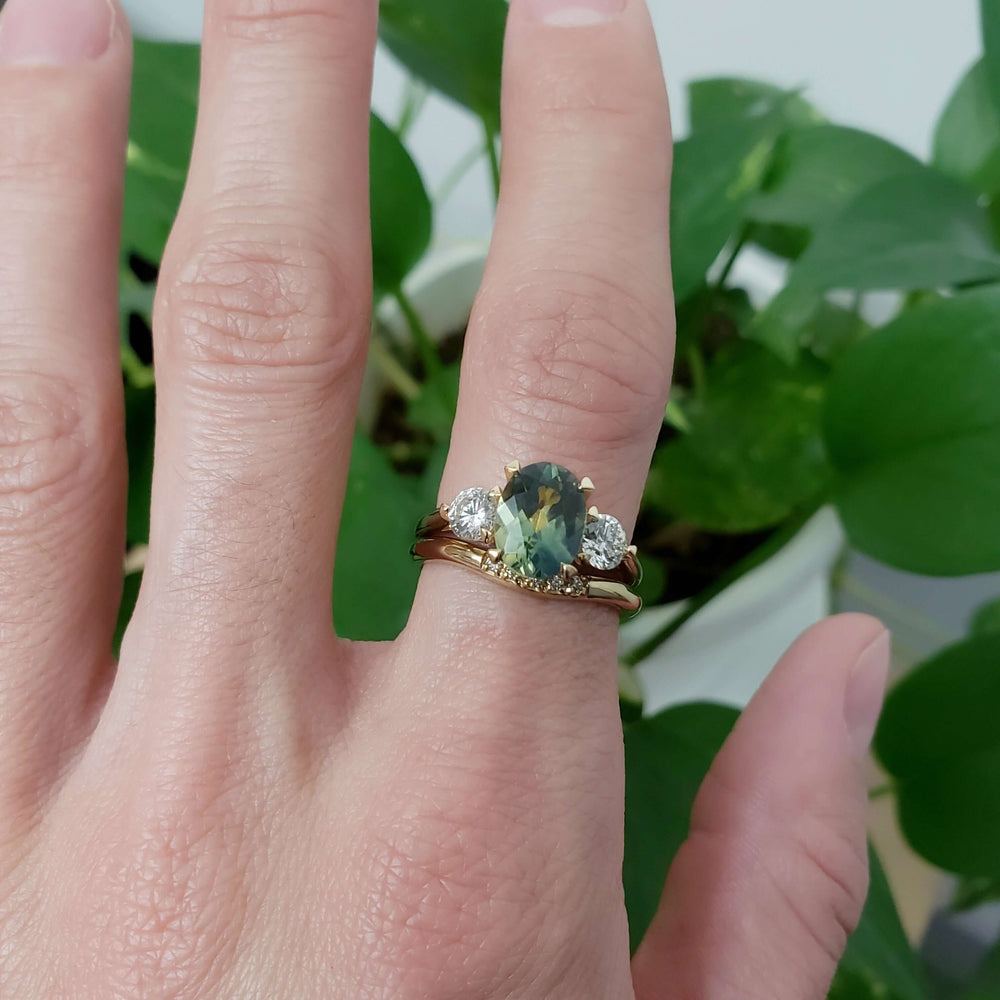 Chevron diamond wedding ring stacked with green sapphire and diamond engagement ring