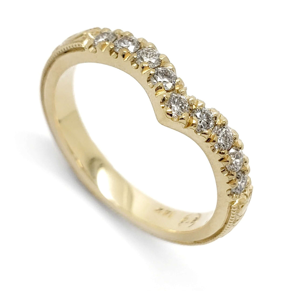 Chevron wedding ring in 14kt yellow gold with prong-set lab-grown diamonds and millgrain detail