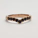 Front view of chevron wedding ring in rose gold with black spinels and engraved details