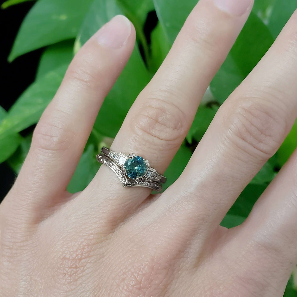 Hand engraved chevron wedding ring in white gold stacked with teal sapphire engagement ring