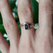 Chevron wheat engraved yellow gold wedding ring stacked with a blue gemstone engagement ring