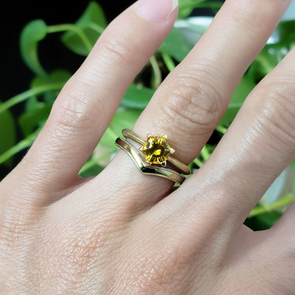 Chevron yellow gold wedding band stacked with yellow gemstone engagement ring