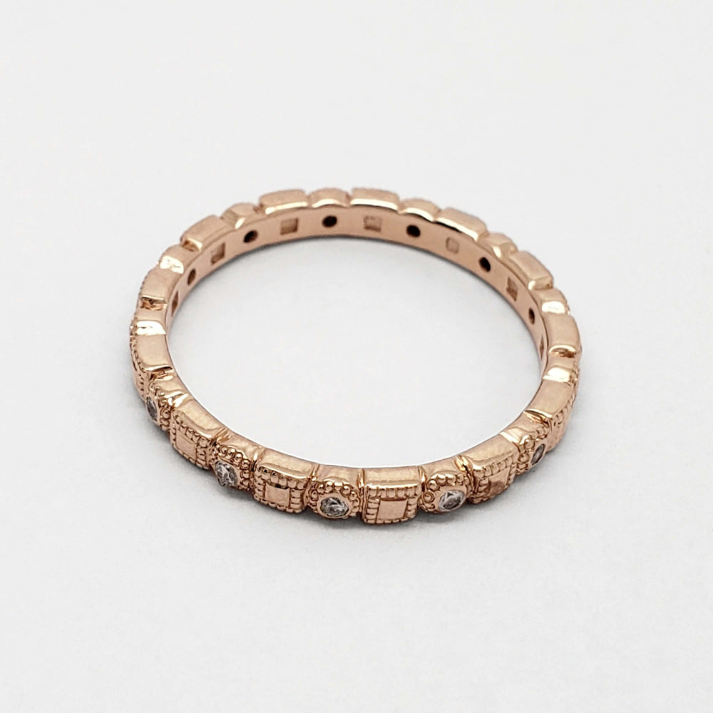 Circle and square motif rose gold diamond ring on white background