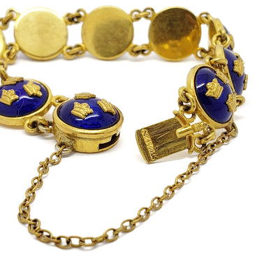 Close-up of Sporrong Tre Kronor bracelet clasp, blue enamel and gold crown details