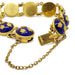 Close-up of Sporrong Tre Kronor bracelet clasp, blue enamel and gold crown details