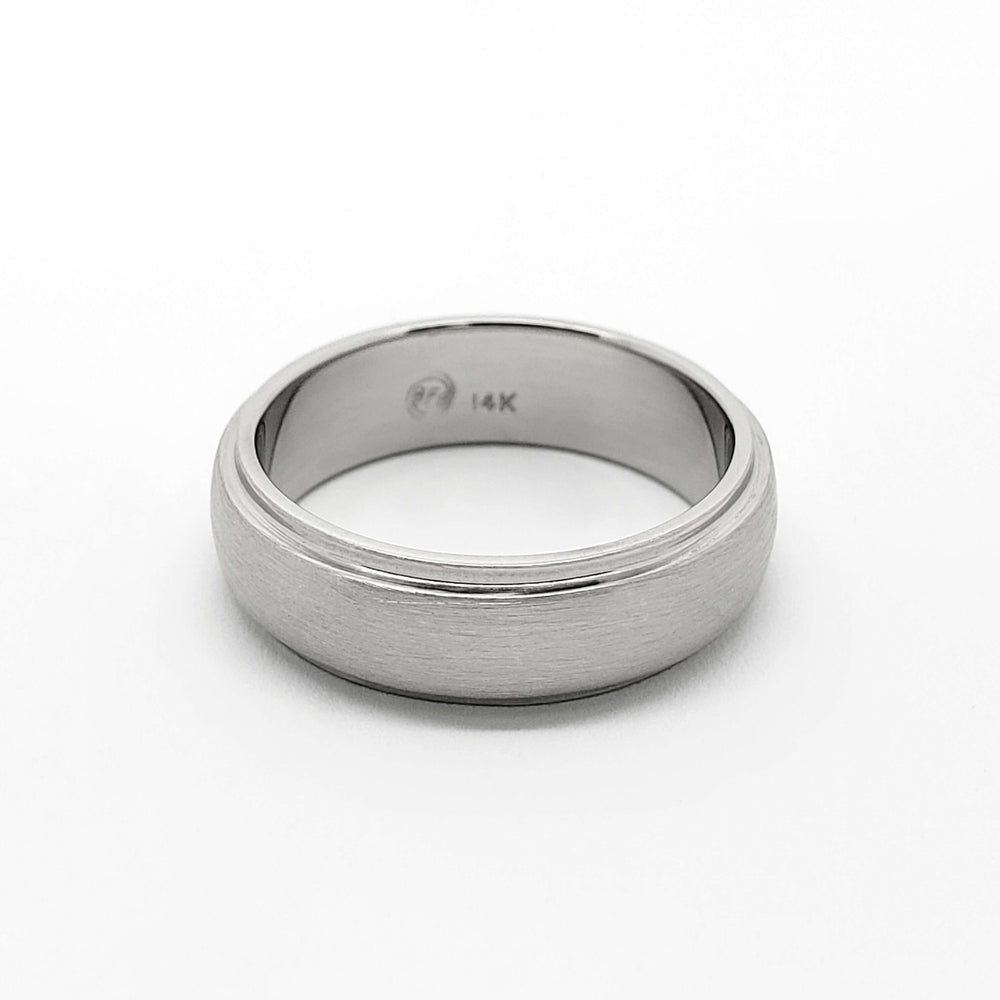 Classic 14kt white gold brushed wedding band with domed step profile, interior 14K stamp