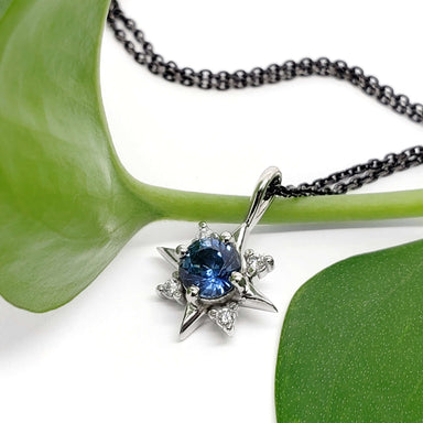 Close-up of North Star pendant in white gold with blue Montana sapphire and lab diamonds