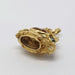 Close-up of antique 18kt yellow gold pendant featuring an oval citrine and round peridot