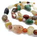 Close-up of multicolour agate beads on a handcrafted silver necklace