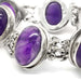 Close-up of oval cabochon amethyst set in sterling silver bracelet