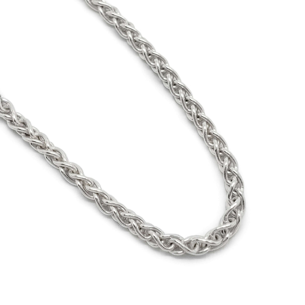 Close-up of sterling silver wheat chain bracelet links