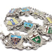 Close-up of vintage silver bracelet with colourful enamel Canadian crests