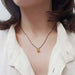 Cushion citrine pendant necklace in yellow gold worn on model
