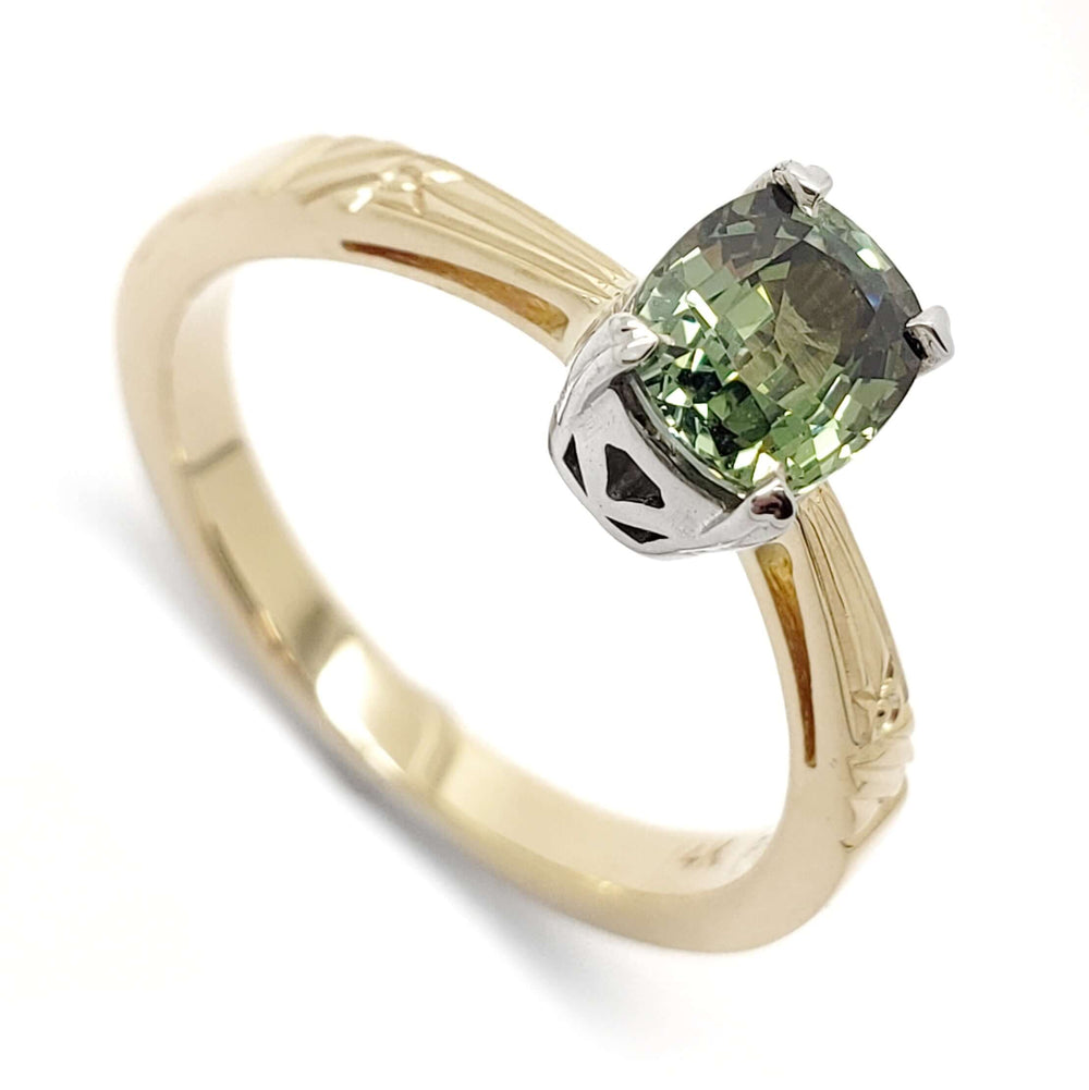 Cushion cut green sapphire engagement ring in 14kt yellow and white gold with engraved details