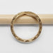 Detailed view of engraved and millgrain edges on 14kt yellow gold chevron wedding ring