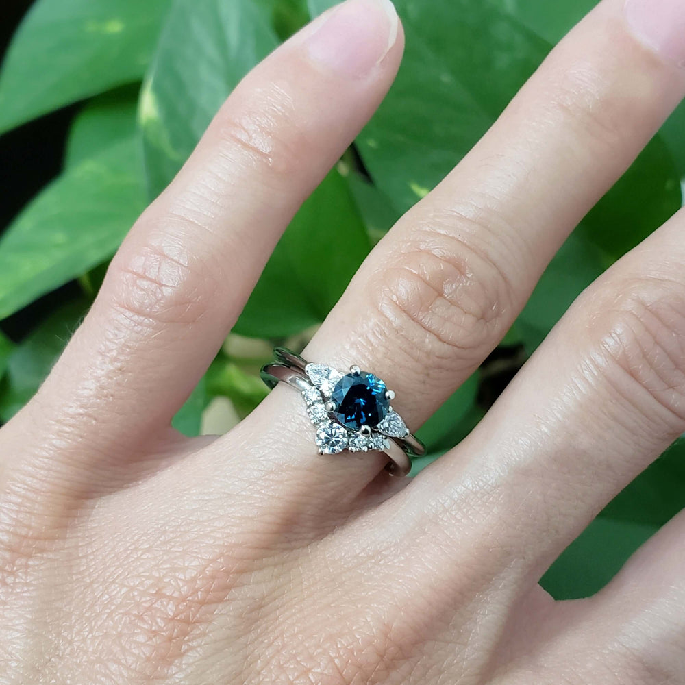 Diamond chevron wedding ring stacked with blue sapphire engagement ring