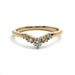 A yellow gold V-shaped ring featuring a central round diamond flanked by smaller round diamonds, set against a plain white background.