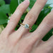Yellow gold diamond wedding band paired with a solitaire diamond engagement ring