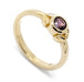14kt yellow gold engagement ring with bezel-set purple Montana sapphire and leaf detail