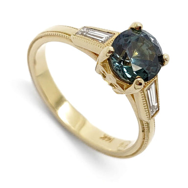 14K yellow gold ring with teal Montana sapphire and baguette diamonds, millgrain detail