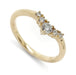 A yellow gold five-stone diamond ring with a marquise-cut center stone and three round-cut accent stones, shown on a clean white background.
