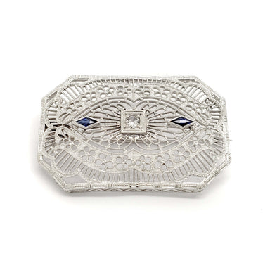 Edwardian filigree brooch in white gold with glass centre and two blue synthetic sapphires