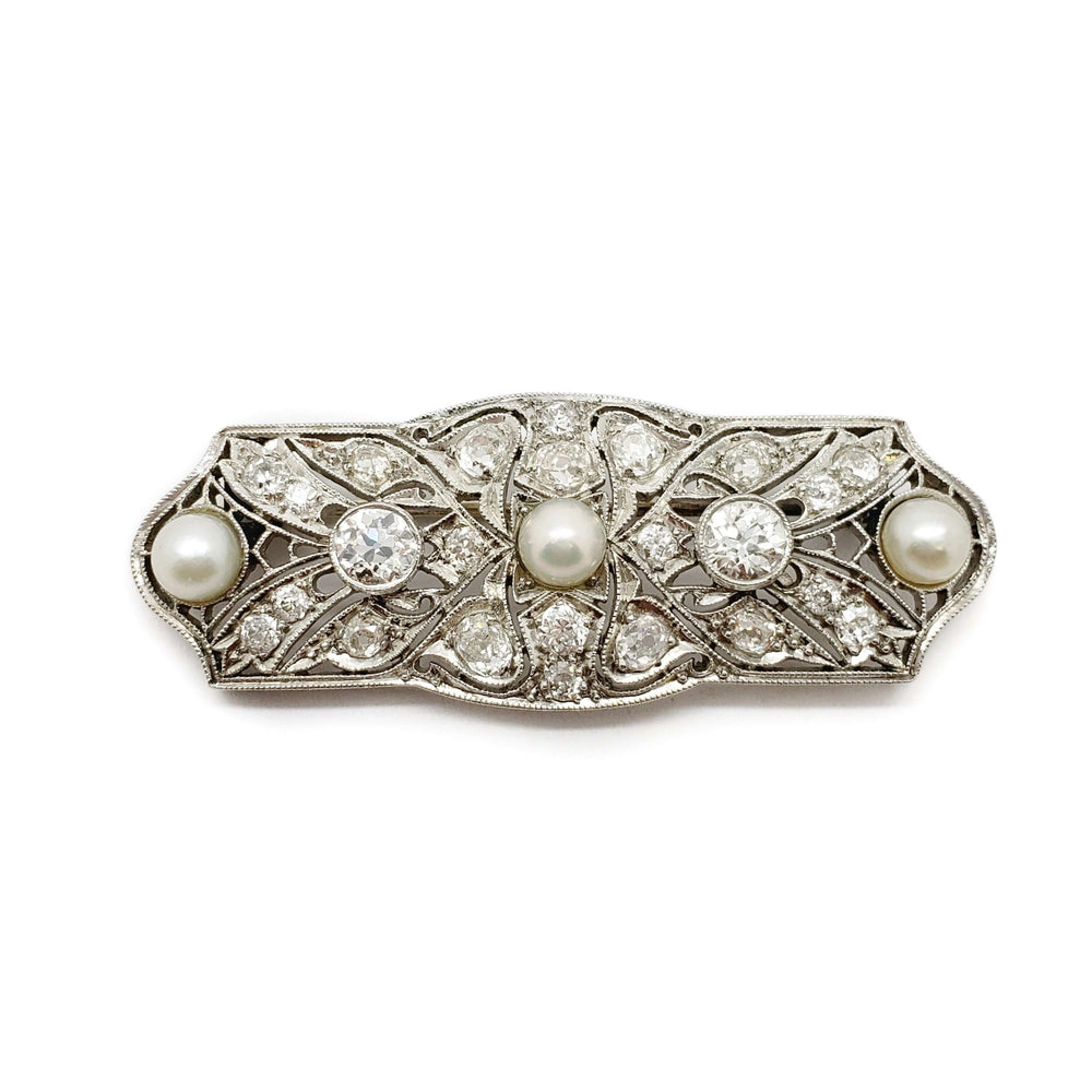 Edwardian platinum brooch set with old cut diamonds and three pearls, floral filigree design